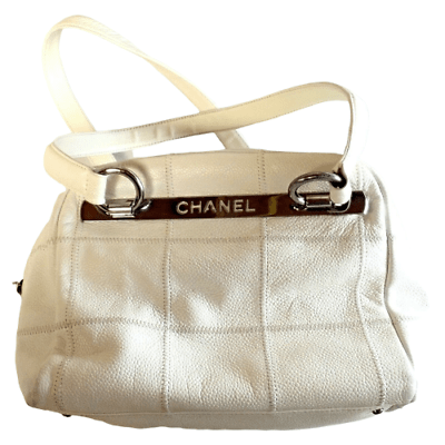 Lot - White Embossed CHANEL Vintage Bag